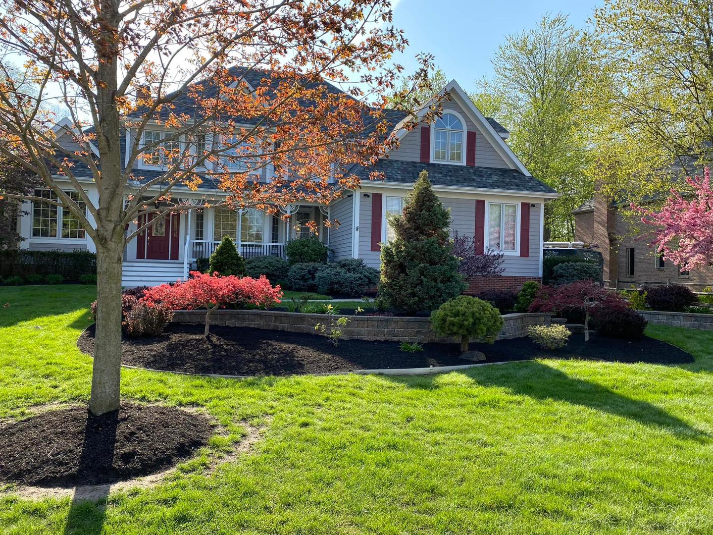 early spring lawn care Springfield MO green lawn landscaping healthy yard